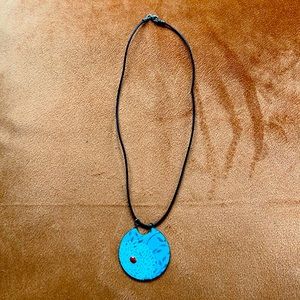 Hand painted pendant on leather cord